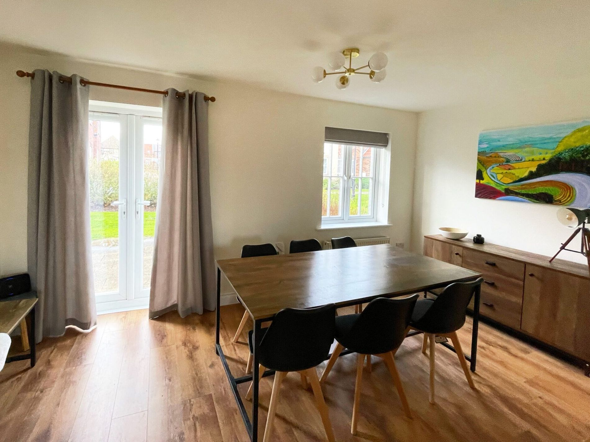 The dining room at Caramel Cottage with a table and six chairs