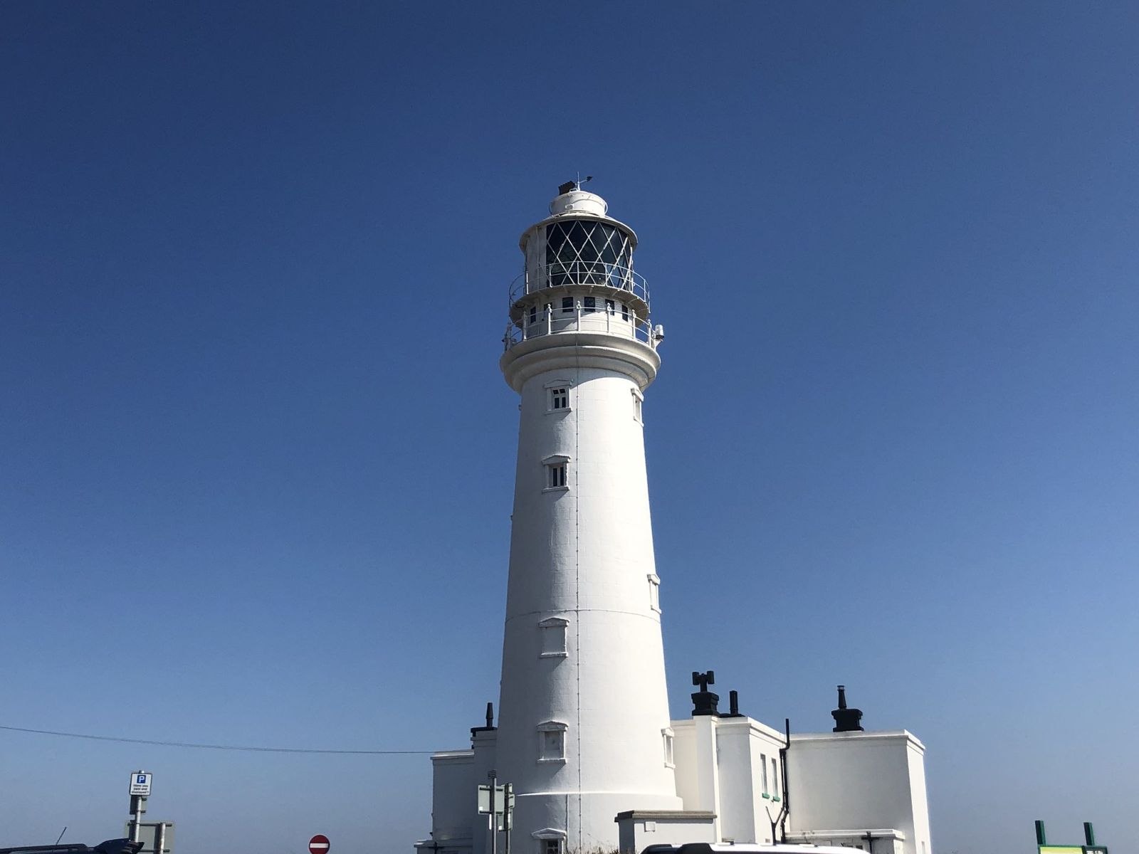 The white lighthouse at Flamborough Head against a clear sky