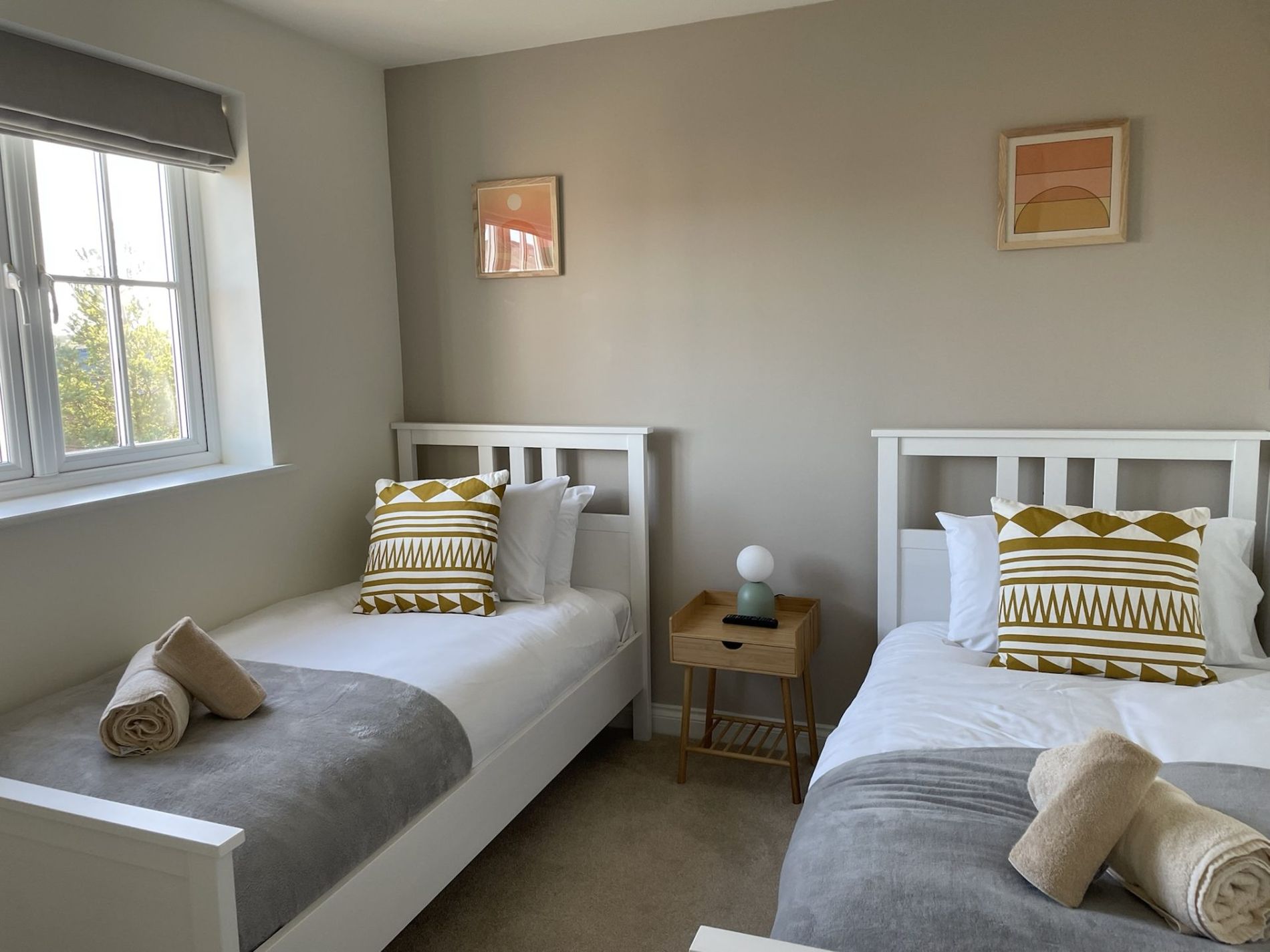 The twin bedroom at Caramel Cottage with two single beds